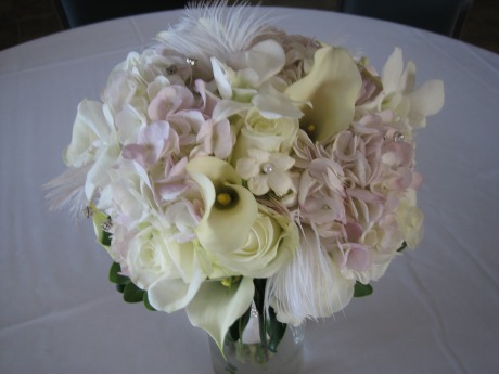  to incorporate feathers crystals and pearls into her bridal bouquet